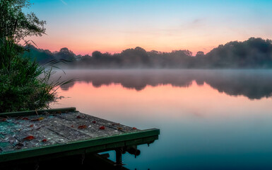Codnor Park, a misty sunrise over a lake with a footbridge
