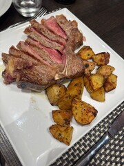 Delicious Grilled Steak with Roasted Potatoes on Plate