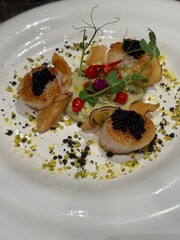 Gourmet Scallops with Caviar and Edible Garnishes