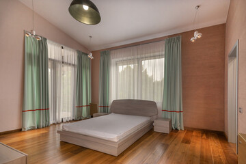 Bedroom interior with modern design and stylish decor. Large windows allow natural light to enter the room.