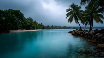 Obraz premium Serene tropical inlet bathed in dramatic moody light with palm trees and a gentle rain falling on turquoise waters