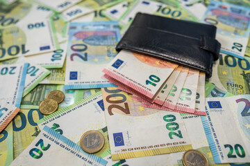 Euro banknotes and wallet background symbol of personal finance