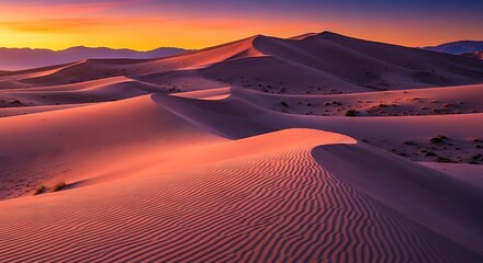 Majestic desert landscape with undulating sand dunes, vibrant sunset hues, and distant mountains creating a serene natural vista.