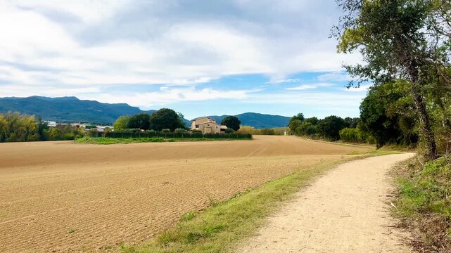 Scenic Countryside Path with Fields and Mountains in Cornell&agrave; de Terri, Girona