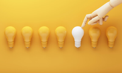A white bulb selected among yellow bulbs symbolizes unique thinking and creative decisions that stand out leading toward fresh ideas and business innovation. 3d rendering.
