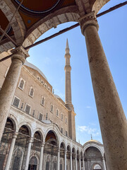 Fototapeta premium Majestic Mosque Facade with Minaret under Blue Sky