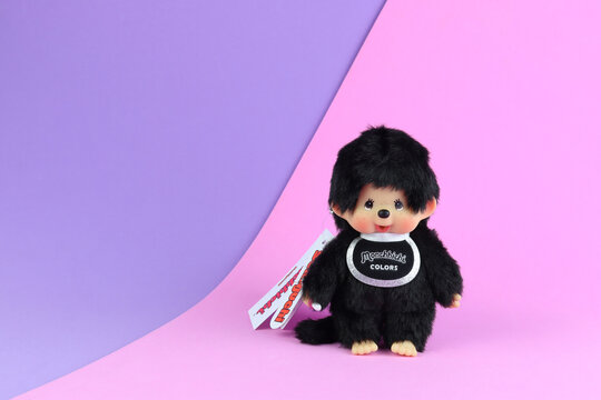 Tokyo Japan 11 October 2025, popular classic plush doll toy , Monchichi or Monchhichi , Japanese cute black monkey fur doll display on pink and purple background in souvenir tourist shop in Japan doll