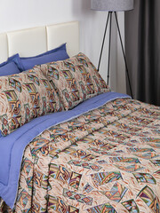 sofa cushions and bedspreads made of tapestry on a sofa or armchair, variegated fabric