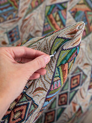 sofa cushions and bedspreads made of tapestry on a sofa or armchair, variegated fabric