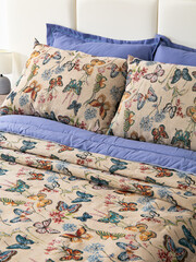 sofa cushions and bedspreads made of tapestry on a sofa or armchair, variegated fabric