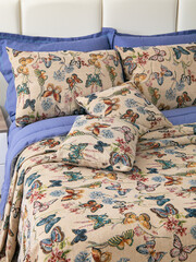 sofa cushions and bedspreads made of tapestry on a sofa or armchair, variegated fabric