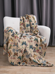sofa cushions and bedspreads made of tapestry on a sofa or armchair, variegated fabric