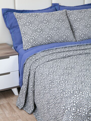 sofa cushions and bedspreads made of tapestry on a sofa or armchair, variegated fabric