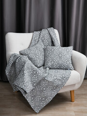 sofa cushions and bedspreads made of tapestry on a sofa or armchair, variegated fabric