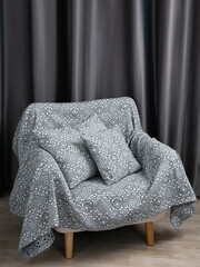 sofa cushions and bedspreads made of tapestry on a sofa or armchair, variegated fabric