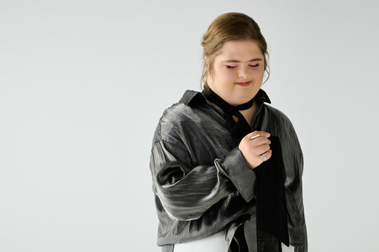 Young woman radiates joy and confidence while celebrating her uniqueness and dreams