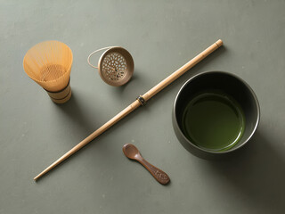Traditional Japanese matcha tea ceremony set with bamboo whisk, spoon, and bowl