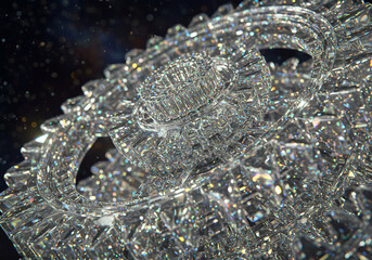 Close-up view reveals intricate details of a sparkling, ornate crystal object.