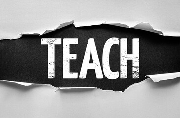 Torn paper effect revealing the word TEACH in bold distressed font, representing education,...