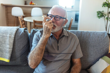 Senior man, asthma inhaler and breathe with pharmaceutical product, medical or healthcare. Elderly...