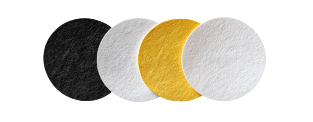 Three circular, textured discs in black, white, and gold