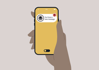 A person checks their smartphone, receiving a message from a scammer, highlighting modern concerns about online security and communication.