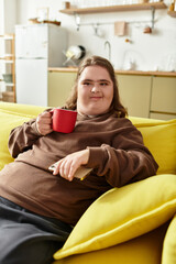 Obraz premium Joyful moments of a young woman with Down syndrome enjoying her relaxing time at home