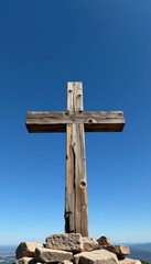 Vertical Christian Cross Wall Art Displayed Against Clear Sky Outdoor Landscape Inspiring Symbolism