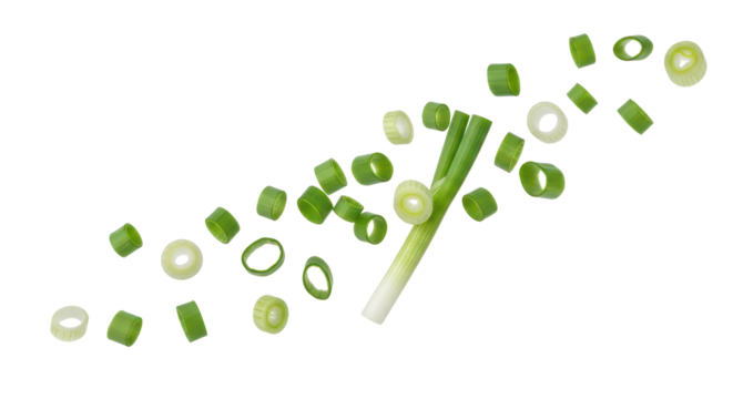 Flying chopped scallion rings, fresh green onion isolated background