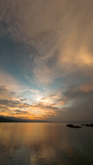 Obraz premium Dramatic Sunset Over Still Lake Water