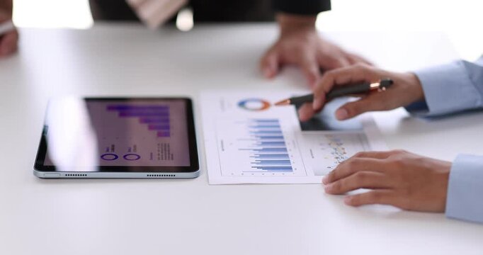 Female health insurance broker presenting his insurance benefits to businessman fill out insurance policy. To prevent future incidents.
