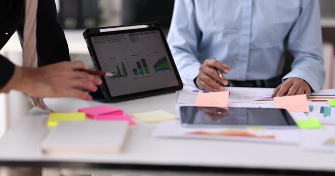 Business man investment consultant analyzing company annual financial report balance sheet statement working with documents graphs. Concept picture of business, market, office, tax.
