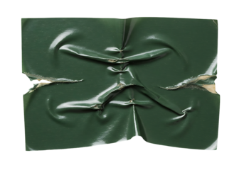 Distorted deep green glossy plastic film with sharp creases and ragged tears on transparant background creating an abstract texture