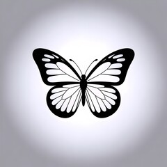Elegant black and white butterfly silhouette symbolizing transformation and natural beauty against a soft gradient background.