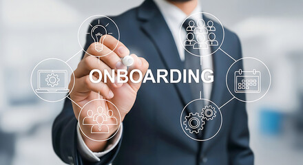 Man in suit writing onboarding diagram with icons business