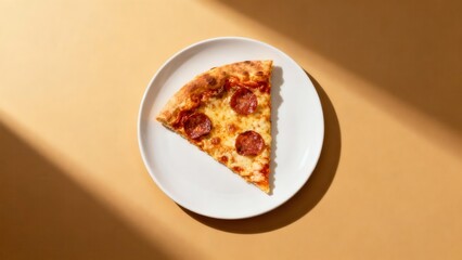 Pepperoni pizza slice on a white plate with dramatic shadows.