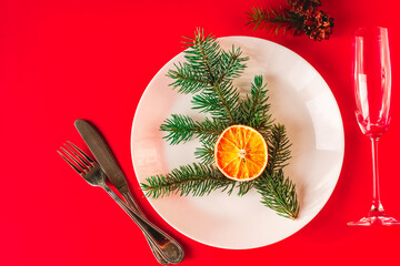 Christmas table setting for christmas dinner, served table with plate, gift, champagne glass, New...