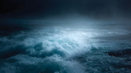 Fototapeta premium Dynamic churning ocean waves surge through dark misty waters under atmospheric light