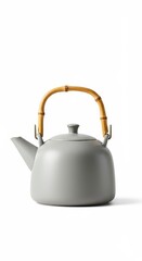 Obraz premium Minimalist ceramic teapot with a natural bamboo handle rests against a white background