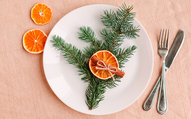 Christmas table setting for christmas dinner, served table with plate, gift, champagne glass, New year decorations. Flat lay, top view
