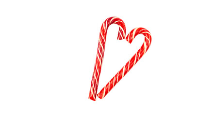 Heart made from Christmas candy canes on a white background