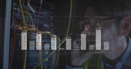 Monitoring IT technician holding smartphone beside racks in server room, cable overlay, copy space