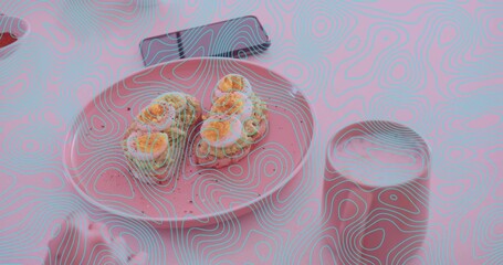 Plate holding two sushi rolls, sauce, roe at dining table beside smartphone, steel tumbler © vectorfusionart