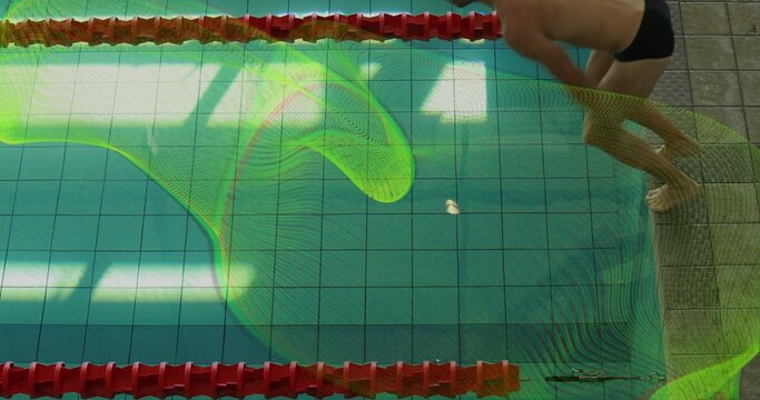 Fototapeta Leaning swimmer in black briefs preparing to dive into pool, with red lane floats, copy space