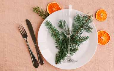 Christmas table setting for christmas dinner, served table with plate, gift, champagne glass, New...