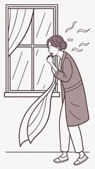 Woman coughing while standing near a window in her home  