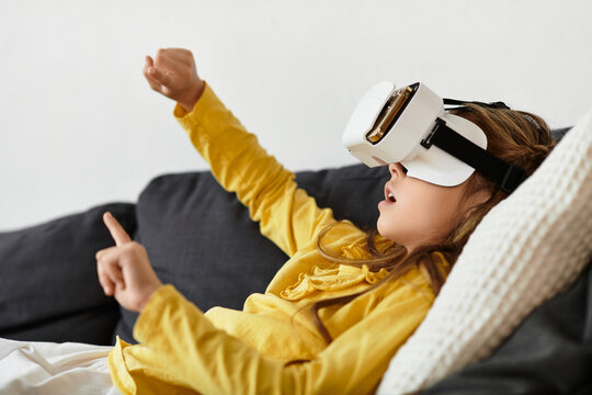 Exciting moments of a girl using virtual reality at home in a cozy setting