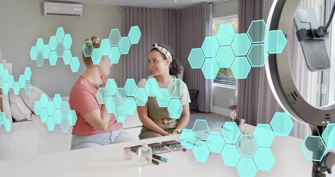 Raising hand greeting camera, vloggers introducing brushes and applying lipstick for makeup demo