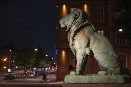 Lion sculpture in front of Ny Carlsberg Glyptotek or New Carlsberg Glyptotek in the evening, Art Museum of Sculpture and Painting, Hans Christian Andersens Boulevard, Copenhagen, Denmark