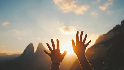 Hands raised towards warm golden sunlight, hopeful gesture, glowing sunrise over mountains, soft dreamy bokeh background
